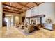 Elegant lobby with stone fireplace, wood-beam ceiling, classic furniture, and tiled floor in a desert community at 2634 N 164Th Ave, Goodyear, AZ 85395