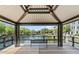 Relaxing waterfront gazebo overlooking a tranquil lake and community landscaping at 2746 S Harmony Ave, Gilbert, AZ 85295