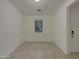 Neutral living room with a tile floor and large window at 2746 S Harmony Ave, Gilbert, AZ 85295