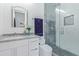 Bathroom featuring a vanity with a framed mirror, toilet and shower with glass door at 2940 E South Mountain Ave, Phoenix, AZ 85042