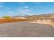 Gravel driveway with desert landscaping, offering a picturesque entry to this modern home at 2940 E South Mountain Ave, Phoenix, AZ 85042