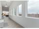 Hallway with large windows and decor, enhancing natural light and a seamless transition between living spaces at 2940 E South Mountain Ave, Phoenix, AZ 85042