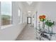 Bright hallway with stylish lighting fixtures and large windows, offering natural light and elegant design at 2940 E South Mountain Ave, Phoenix, AZ 85042