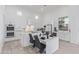 Sleek kitchen with white cabinetry, an island with bar seating, and modern appliances at 2940 E South Mountain Ave, Phoenix, AZ 85042