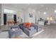 Stylish living room with an open layout, showcasing modern furniture and natural light, plus kitchen view at 2940 E South Mountain Ave, Phoenix, AZ 85042