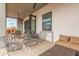 Inviting patio with comfortable seating and a folding glass door creating an open-air living space at 2940 E South Mountain Ave, Phoenix, AZ 85042