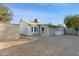 Spacious backyard with a metal storage shed and lattice enclosed porch at 3129 W Mohawk Ln, Phoenix, AZ 85027