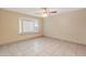 Bright living room featuring tiled floors, ceiling fan, and a charming bay window that bathes the room in natural light at 3129 W Mohawk Ln, Phoenix, AZ 85027