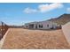 View of the property's backyard, enclosed by a fence, set against a mountain backdrop at 33949 N Borgata Trl, San Tan Valley, AZ 85144