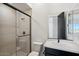 This modern bathroom has a sleek shower, stylish vanity, and plenty of counter space at 33949 N Borgata Trl, San Tan Valley, AZ 85144