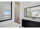 Bathroom featuring dual vanities, large mirrors, and an open concept at 33949 N Borgata Trl, San Tan Valley, AZ 85144