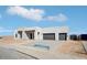 Contemporary home featuring a stone accent wall, black trim and a two car garage at 33949 N Borgata Trl, San Tan Valley, AZ 85144