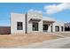 Contemporary home featuring a stone accent wall, black trim and a two car garage at 33949 N Borgata Trl, San Tan Valley, AZ 85144