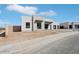 Contemporary home featuring a stone accent wall, black trim and a two car garage at 33949 N Borgata Trl, San Tan Valley, AZ 85144