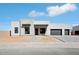 Contemporary home featuring a stone accent wall, black trim and a two car garage at 33949 N Borgata Trl, San Tan Valley, AZ 85144