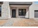 Modern entry way featuring stone accents, a black trim window and contemporary door at 33949 N Borgata Trl, San Tan Valley, AZ 85144