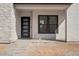 Modern entry way featuring stone accents, a black trim window and contemporary door at 33949 N Borgata Trl, San Tan Valley, AZ 85144