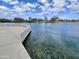 Tranquil community lake featuring clear water, natural vegetation, and diverse aquatic life, fostering serenity at 4102 E Crescent Way, Chandler, AZ 85249