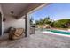 View of the covered patio with outdoor furniture and the backyard pool at 4102 E Crescent Way, Chandler, AZ 85249