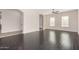 Bright living room with hardwood floors, neutral walls, large windows, and a ceiling fan at 4102 E Crescent Way, Chandler, AZ 85249