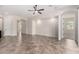 Bright and airy living room with tile flooring and neutral walls, creating a versatile space at 4102 E Crescent Way, Chandler, AZ 85249