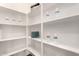 Spacious walk-in pantry with white shelving for storing groceries and household items at 4102 E Crescent Way, Chandler, AZ 85249