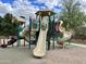 A colorful playground structure boasts slides, climbing areas, and covered platforms for entertainment at 4102 E Crescent Way, Chandler, AZ 85249