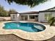 Backyard pool with lush landscaping and covered patio area at 4102 E Crescent Way, Chandler, AZ 85249