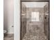 Modern bathroom featuring a glass shower with tile surround, mosaic flooring and updated fixtures at 4102 E Crescent Way, Chandler, AZ 85249