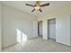 Bedroom featuring a closet with sliding doors and wood-look tile flooring at 4240 N Arizona Rd, Eloy, AZ 85131