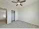 Bedroom with wood-look tile floors and closet with sliding doors at 4240 N Arizona Rd, Eloy, AZ 85131