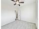 Bright bedroom with a ceiling fan, tile flooring, and an open doorway at 4240 N Arizona Rd, Eloy, AZ 85131