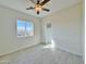 Sunny bedroom with a ceiling fan, tile flooring, and a closet at 4240 N Arizona Rd, Eloy, AZ 85131