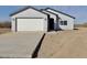 Charming single-Gathering home featuring a stucco exterior, a two-car garage and desert landscaping at 4240 N Arizona Rd, Eloy, AZ 85131