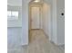 Bright foyer with neutral tile flooring, white walls, and a view into the living space at 4240 N Arizona Rd, Eloy, AZ 85131