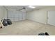 Spacious two-car garage with painted floors and a white pedestrian door at 4240 N Arizona Rd, Eloy, AZ 85131