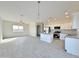 Modern kitchen with stainless steel appliances, white cabinets, and a center island at 4240 N Arizona Rd, Eloy, AZ 85131