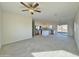 Spacious open floor plan with a ceiling fan, tile flooring, and natural light at 4240 N Arizona Rd, Eloy, AZ 85131