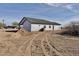 Back exterior view of a one-story house with ample yard space at 4240 N Arizona Rd, Eloy, AZ 85131