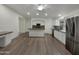 Spacious kitchen featuring an island, granite countertops, and modern stainless steel appliances at 42618 W Oakland Dr, Maricopa, AZ 85138