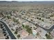 An aerial image captures a neighborhood of single-Gathering homes with desert landscaping and views of desert mountains at 4315 W Phalen Dr, New River, AZ 85087