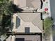 An aerial view shows a roof with solar panels and a desert-style yard, with trees and plants at 4315 W Phalen Dr, New River, AZ 85087