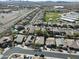 This is an aerial view of a neighborhood featuring single-Gathering homes, a community park, and desert landscaping at 4315 W Phalen Dr, New River, AZ 85087