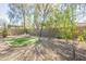 Enjoy the landscaped backyard with a patch of artificial turf, mature trees, and low-maintenance desert landscaping at 4315 W Phalen Dr, New River, AZ 85087