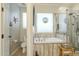 Bathroom featuring a soaking tub with a shower and natural light at 4315 W Phalen Dr, New River, AZ 85087