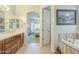 Elegant bathroom with a soaking tub adjacent to the primary bedroom and a double sink vanity at 4315 W Phalen Dr, New River, AZ 85087