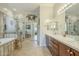 Spa-like bathroom featuring double sinks, a soaking tub, and a glass-enclosed walk-in shower at 4315 W Phalen Dr, New River, AZ 85087