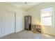 Neutral bedroom featuring a large closet, small book shelf, and security safe at 4315 W Phalen Dr, New River, AZ 85087