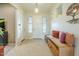 Welcoming entryway featuring tile flooring, neutral walls, and a charming bench with storage at 4315 W Phalen Dr, New River, AZ 85087