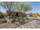 Inviting home featuring low-maintenance desert landscaping and a well-manicured front yard at 4315 W Phalen Dr, New River, AZ 85087